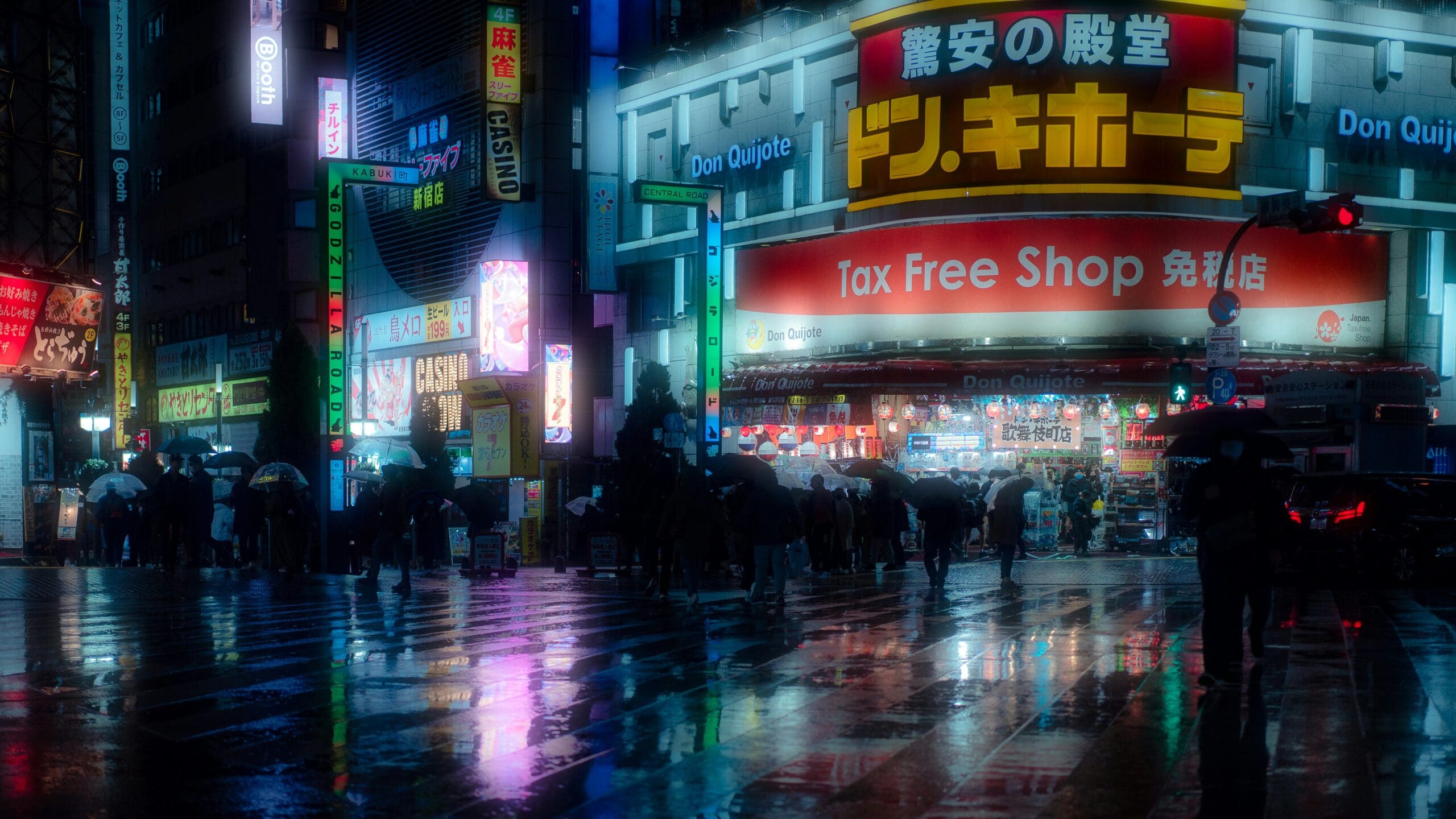 Night lights in busy street, tax free shop building